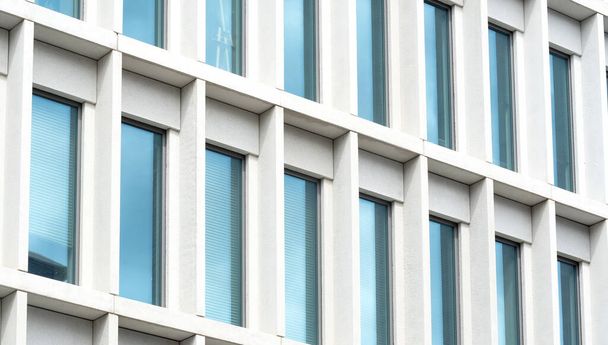 Simple generic office building detail, glass windows, closeup, modern business architecture details up close, simple background. City life, urban detail, business building wall, exterior up close - Photo, image