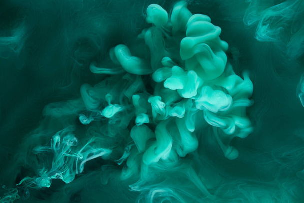 Liquid fluid art abstract background. Blue green acrylic paint underwater, galactic smoke ocean - Foto, afbeelding