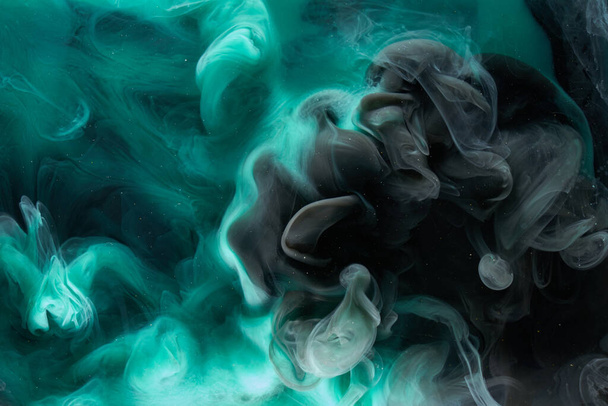 Liquid fluid art abstract background. Blue green acrylic paint underwater, galactic smoke ocean - Фото, изображение