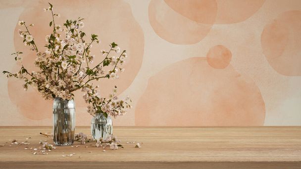 Wooden table, desk or shelf close up. Branches of cherry blossoms in glass vase. Plaster painted wall in orange tones with copy space, template, mock up, spring concept - Foto, Imagen