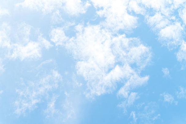 Beautiful white fluffy clouds in blue sky. Nature background from white clouds in sunny day. - Foto, Imagem