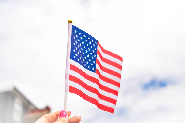 Close up of national flag of USA stripes and stars red and blue colors. - 写真・画像