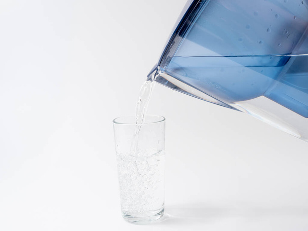 Jug with water filter made of transparent plastic. Drinking water filter. - Fotografie, Obrázek