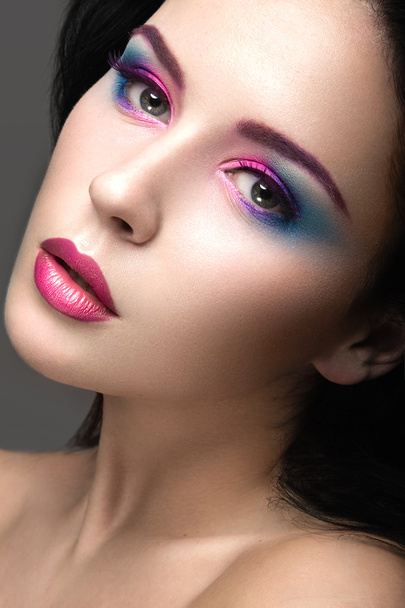Beautiful girl with bright pink make-up and perfect skin. Beauty face. Festive image. - Photo, image