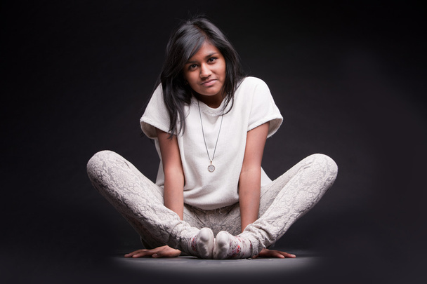 portrait of a crouched indian girl - Φωτογραφία, εικόνα