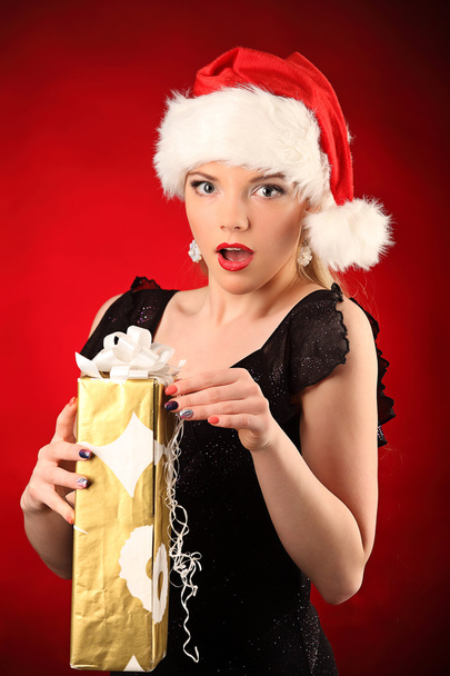 Portrait of beautiful sexy girl wearing santa claus clothes - Photo, image