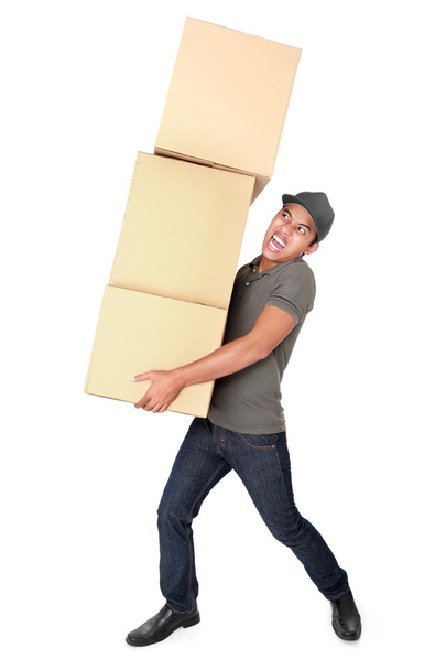 Man Holding some heavy Stack Of Cardboard Boxes - Zdjęcie, obraz