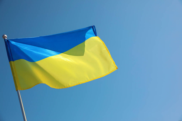 National flag of Ukraine fluttering on sunny day outdoors - 写真・画像