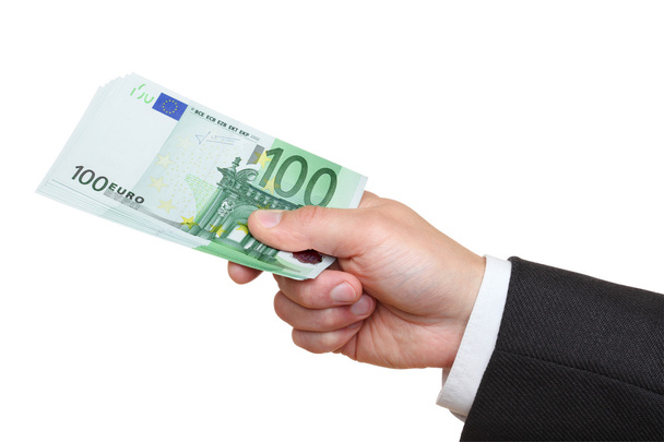 Десница бизнесмена, держащего банкноты в сто евро
. - Фото, изображение