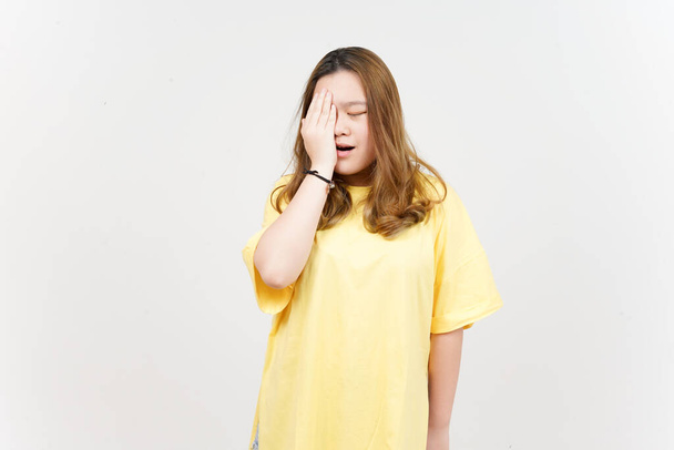 Suffering Headache of Beautiful Asian Woman wearing yellow T-Shirt Isolated On White Background - Fotografie, Obrázek