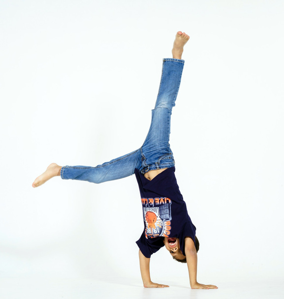Young active afro-american boy doing gymnastics  - Fotografie, Obrázek