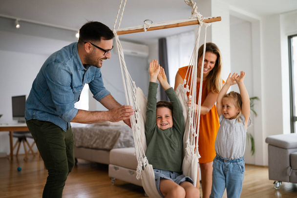 Happy family having fun and spending time together at home. Child parenting love concept - Photo, image