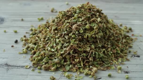 Raw dried green oregano spice (Origanum vulgare) - Filmati, video