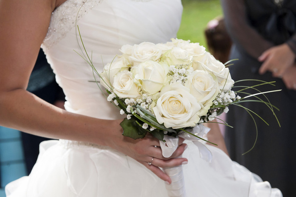 bride holding bouquet of flowers - Фото, изображение