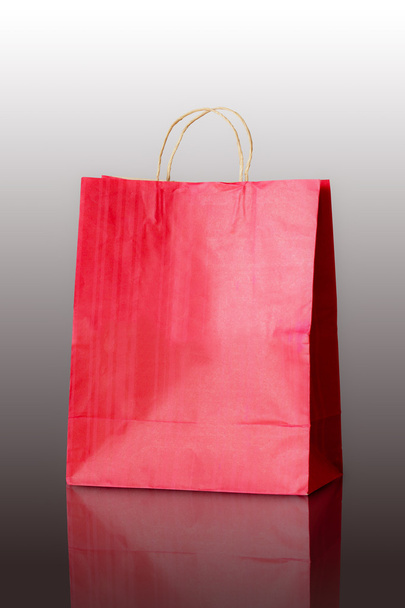 Red paper bag on reflect floor - Photo, Image