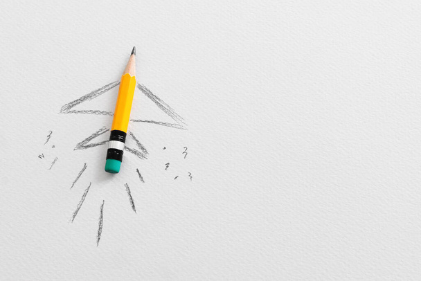 Pencil and rocket sketch over textured paper, concept of back to school, creativity and success - Фото, изображение