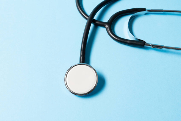 Close up view of stethoscope on the blue background. - Fotó, kép