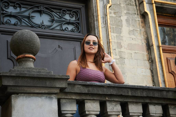 A young Hispanic female standing on the balcony - Fotografie, Obrázek