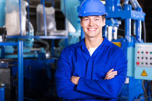 Factory technician with crossed arms - Foto, Bild