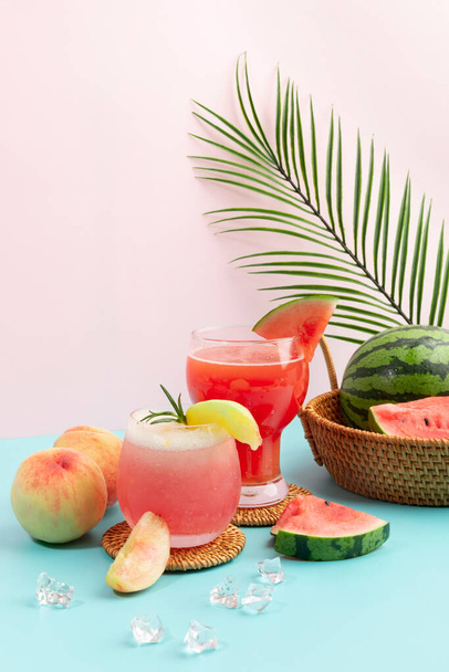 Summer drink background with peach and watermelon juice drink - 写真・画像