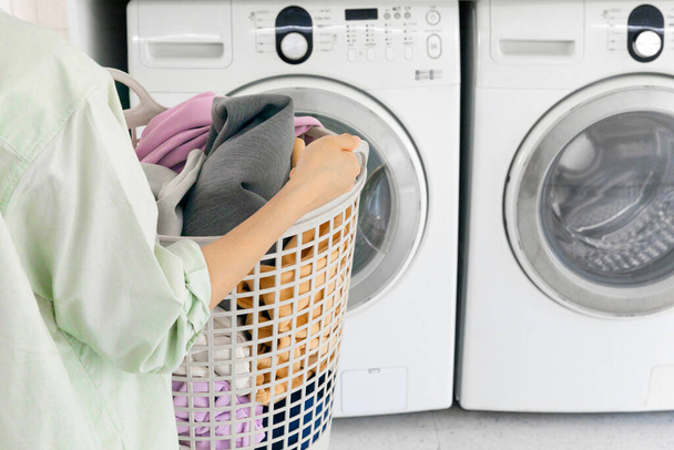 aesthetic laundry concept, Laundry basket filled with clothes - 写真・画像