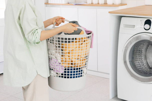 aesthetic laundry concept, Laundry basket filled with clothes - Photo, Image