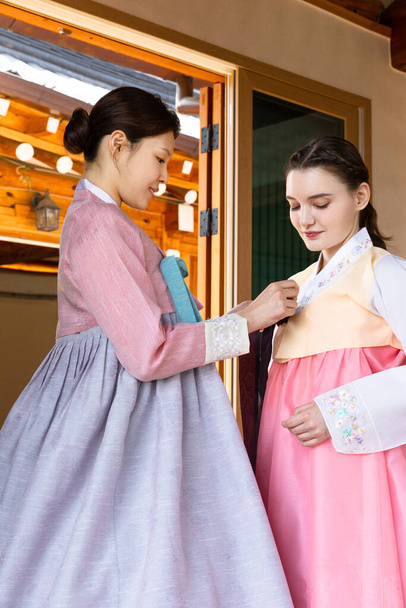 Korean and Caucasian girls wearing Hanbok, Korean traditional clothes - Фото, зображення