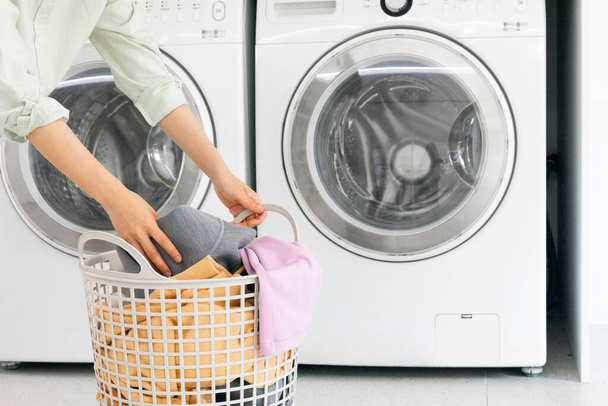 aesthetic laundry concept, Putting laundry into the washing machine - Φωτογραφία, εικόνα