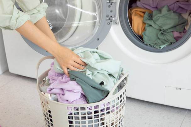 aesthetic laundry concept, Putting laundry into the washing machine - Zdjęcie, obraz