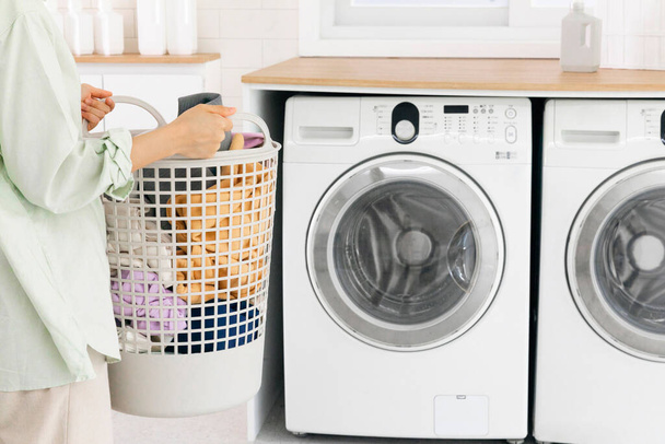 aesthetic laundry concept, Putting laundry into the washing machine - Foto, Imagen