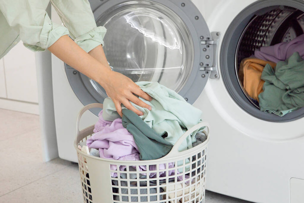 aesthetic laundry concept, Connecting washing machine app with mobile phone - 写真・画像