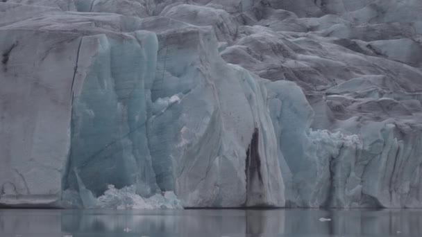 Spectacular long shot closeup of glacier tongue end with cracks - Materiał filmowy, wideo