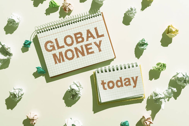 Text showing inspiration Global Money, Business approach International finance World currency Transacted globally Notebooks With Important Messages Surrounded By Paper Wraps. - Valokuva, kuva