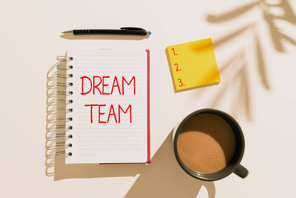 Handwriting text Dream Team, Conceptual photo Prefered unit or group that make the best out of a person Notebook With Important Messages On Desk With Coffee, Notes And Pen. - Fotoğraf, Görsel
