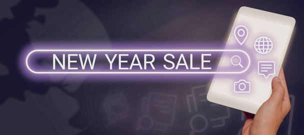 Text sign showing New Year Sale, Business showcase Final holiday season discounts price reductions Offers Businessman Holding A Pad Displaying Digital S Around A Search Bar. - Foto, Imagen