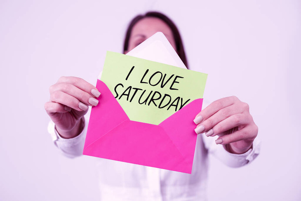 Text showing inspiration I Love Saturday, Word Written on To have affection for the weekend happy excited relax Woman Holding Letter And Envelope Sending Important Information. - Photo, image