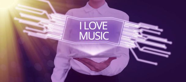 Hand writing sign I Love Music, Word Written on Having affection for good sounds lyric singers musicians Businesswoman Holding Tablet And Presenting New Ideas In Futuristic Frame. - 写真・画像