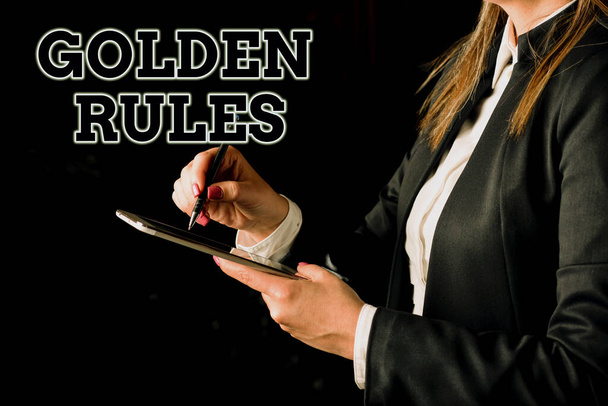 Sign displaying Golden Rules, Business showcase Basic principle that should be followed Important Principle Businesswoman Holding Tablet In One Hand And Pointing With Pen On It - Foto, Bild