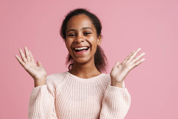 Brunette black girl gesturing while laughing at camera isolated over pink background - Foto, Imagem