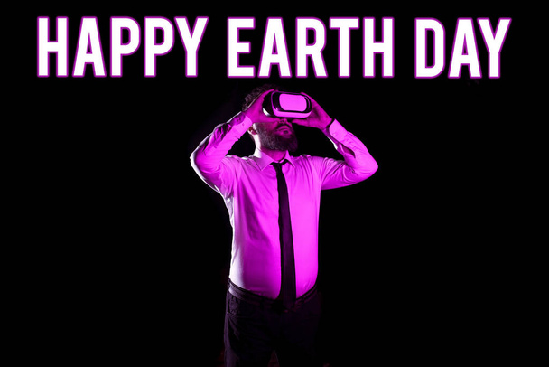 Conceptual display Happy Earth Day, Concept meaning Worldwide celebration of ecology environment preservation Businessman Taking Professional Training Through Virtual Reality Goggles. - Photo, image