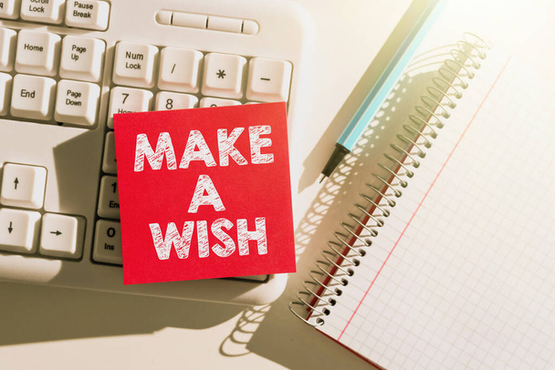 Text caption presenting Make A Wish, Word for To have dreams desires about future events Be positive Important Messages Written On Note On Desk With Pen, Notebook And Keyboard. - Φωτογραφία, εικόνα