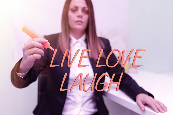 Text caption presenting Live Love Laugh, Conceptual photo Be inspired positive enjoy your days laughing good humor Businesswoman Holding Marker With One Hand And Pointing Important Ideas. - Foto, Imagen