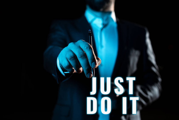Conceptual display Just Do It, Conceptual photo Motivation for starting doing something Have discipline Businessman Pointing Important Informations With Pen In Hand. - Foto, afbeelding