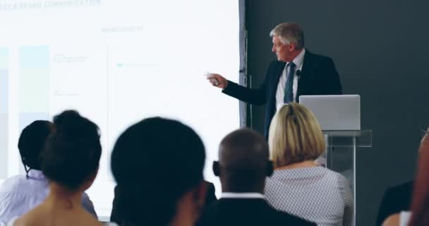 Education, training and learning business people at conference, presentation and office seminar. Confident mature manager, boss and ceo speaking, presenting and teaching diverse staff in workshop. - Filmmaterial, Video