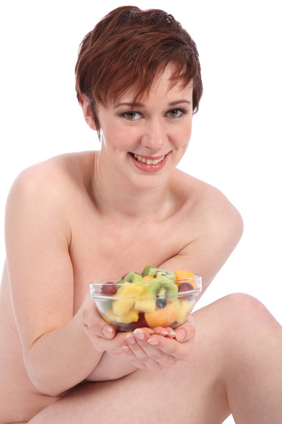 Woman with a fresh fruit salad - 写真・画像