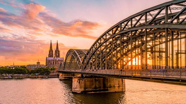 Cologne Koln Germany during sunset, Cologne bridge with the cathedral. beautiful sunset at the Rhine river - Fotó, kép