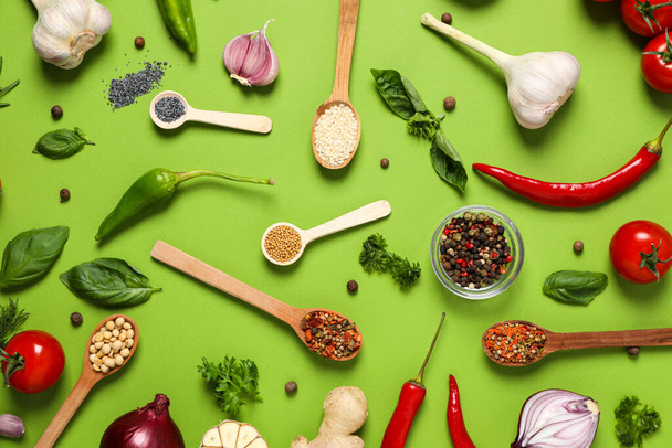 Different ingredients for cooking on green background - Foto, afbeelding