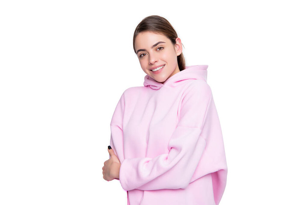 cheerful young woman in pink hoodie isolated on white background. - Foto, Bild