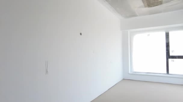 New empty room under construction. Plaster walls. New home. Concrete walls. Interior renovation.  - Footage, Video