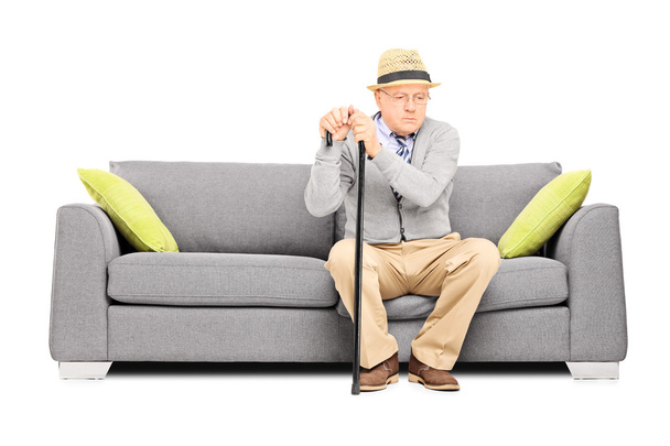 Senior gentleman sitting on sofa - Photo, Image
